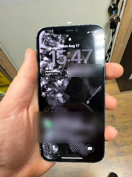iPhone 12 Pro with illuminated display after service