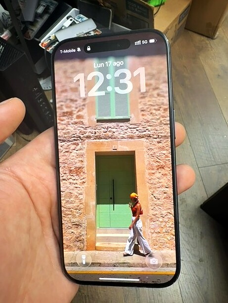 iPhone 15 Pro with illuminated display after service