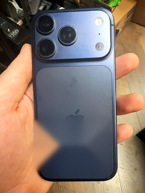 iPhone 15 Pro display with visible damage before service