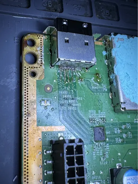 An Xbox Series X HDMI port reconnected with individual hand-run jumper wires to each pin
