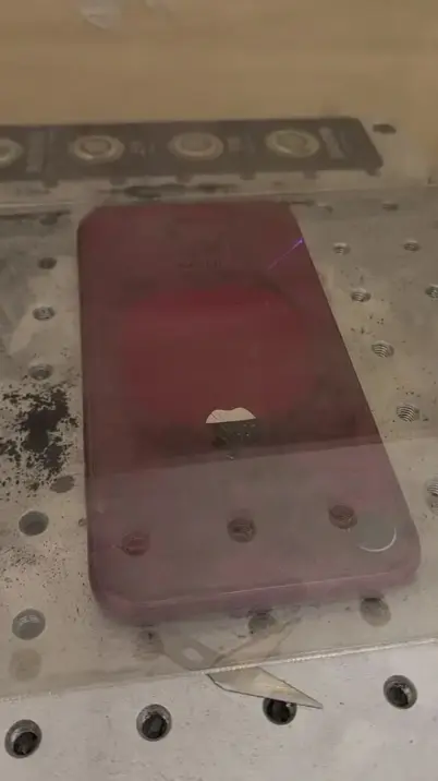 Laser back glass removal on a red iPhone