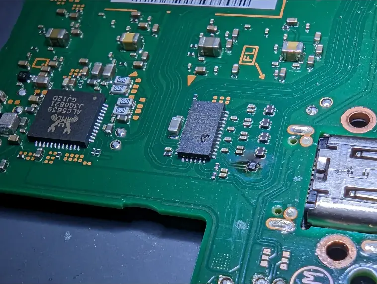 Board-level repair under the microscope at our Charlotte bench