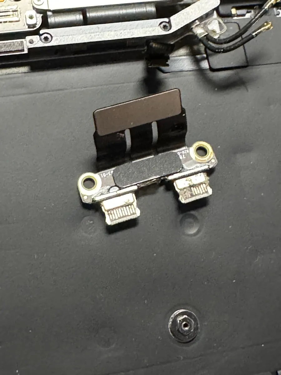 MacBook Pro charge ports, burnt by corrosion after